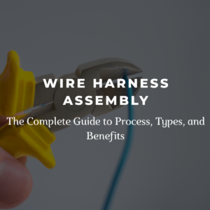 Wire cutters trimming a blue electrical wire during wire harness assembly.